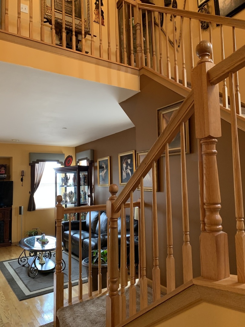 21211 Gray Hawk Drive Matteson, IL 60443 - Photo 10 of 36 a view of entryway livingroom and hall with wooden floor