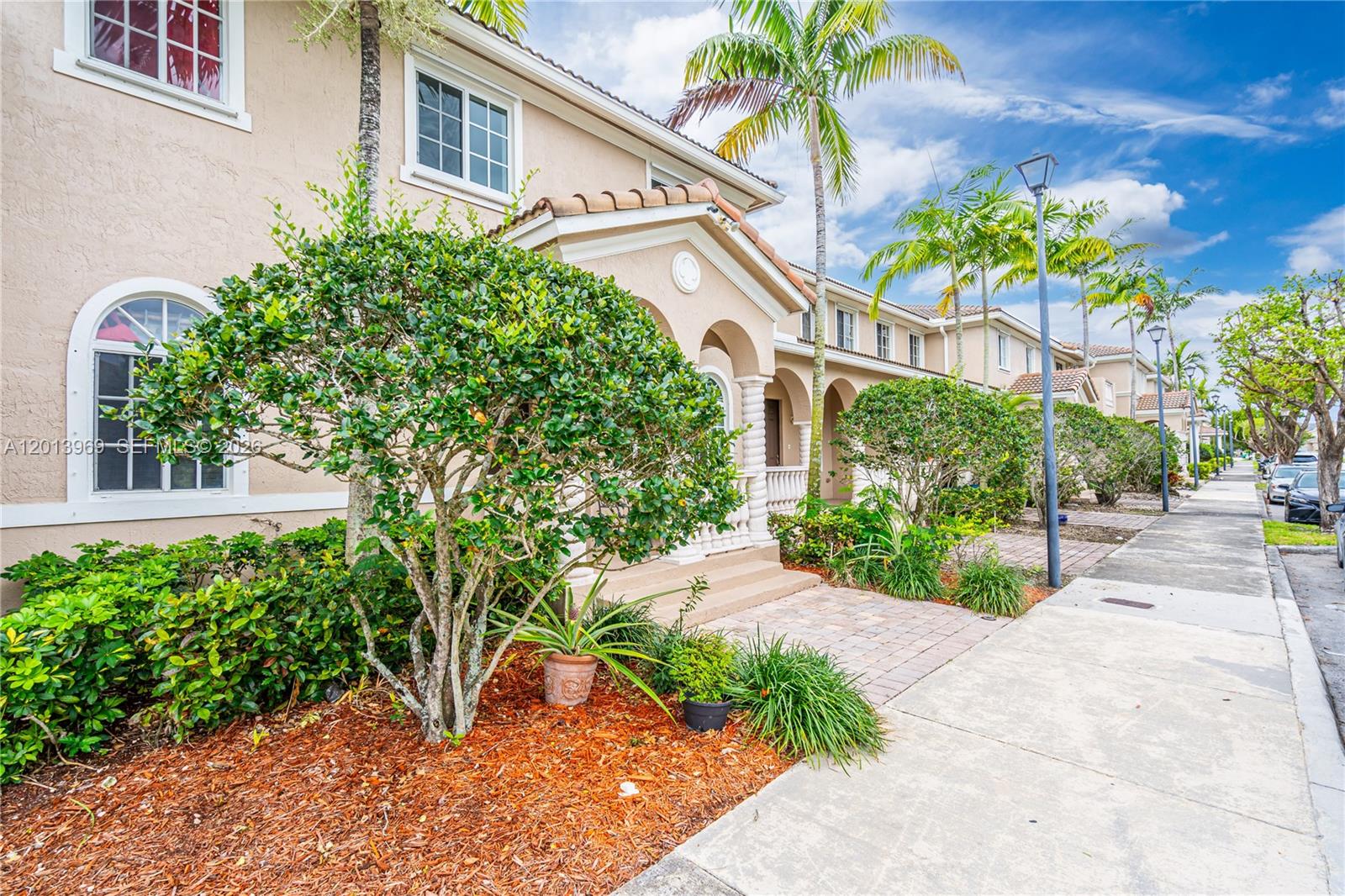 14044 Southwest 273rd Lane, Unit 14044 Homestead, FL 33032 - Photo 30 of 44 a view of a garden with potted plants