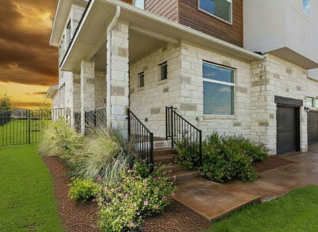 904 Arundel Road Lakeway, TX 78738 - Photo 2 of 40 a view of a back yard of the house