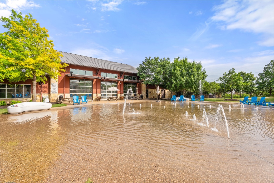 904 Arundel Road Lakeway, TX 78738 - Photo 37 of 40 a view of a swimming pool with an outdoor space and seating area