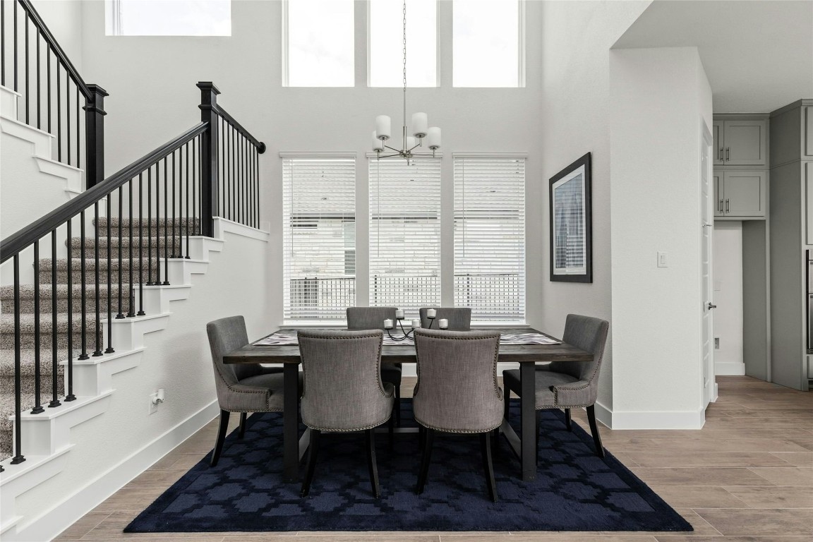 904 Arundel Road Lakeway, TX 78738 - Photo 5 of 40 a view of a dining room with furniture