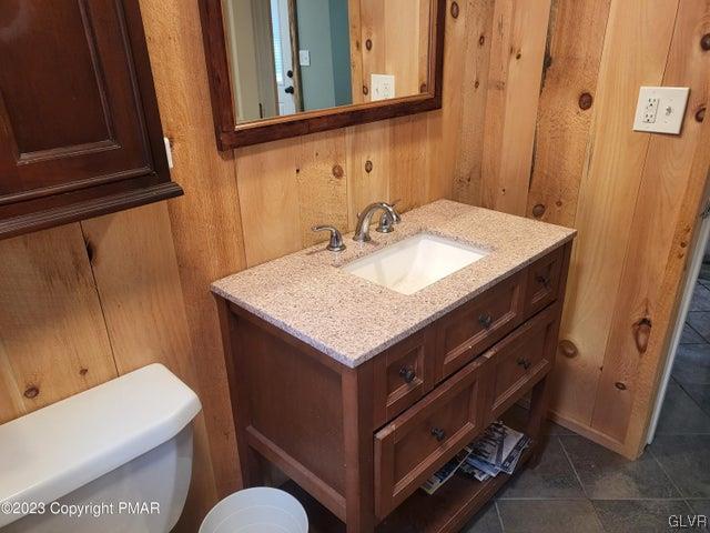 125 Ness Road Dingmans Ferry, PA 18328 - Photo 14 of 29 a bathroom with a sink and a toilet