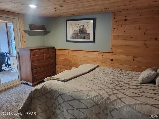 125 Ness Road Dingmans Ferry, PA 18328 - Photo 17 of 29 a bedroom with a bed and a cabinets