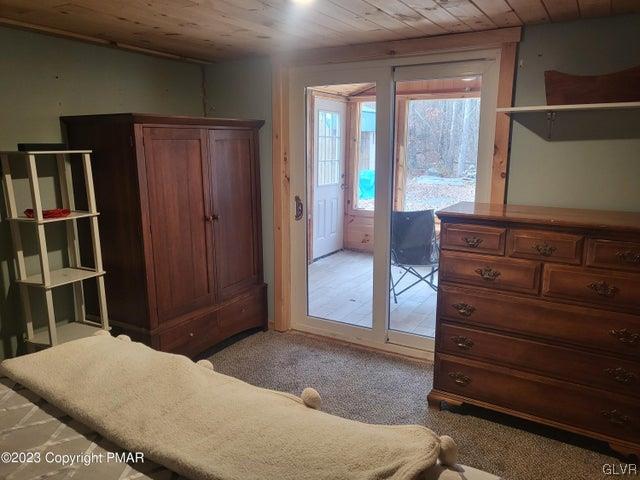 125 Ness Road Dingmans Ferry, PA 18328 - Photo 18 of 29 a bedroom with a bed and a dresser