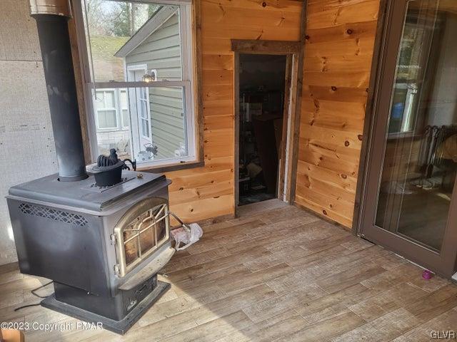 125 Ness Road Dingmans Ferry, PA 18328 - Photo 22 of 29 a spacious bathroom with a granite countertop sink and a mirror