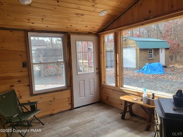 125 Ness Road Dingmans Ferry, PA 18328 - Photo 24 of 29 a room with furniture and a window