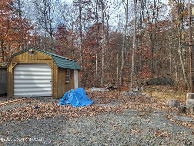 125 Ness Road Dingmans Ferry, PA 18328 - Photo 26 of 29 a front view of a house with a yard