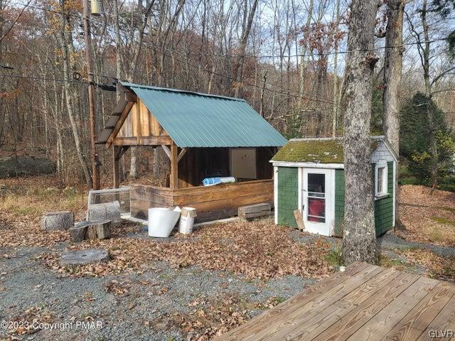 125 Ness Road Dingmans Ferry, PA 18328 - Photo 28 of 29 a front view of a house with garden