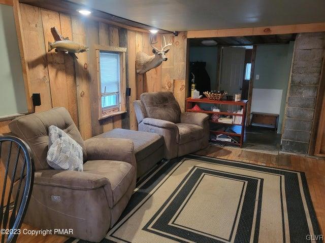 125 Ness Road Dingmans Ferry, PA 18328 - Photo 3 of 29 a living room with furniture