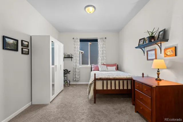 a kitchen with stainless steel appliances kitchen island granite countertop a stove a sink a refrigerator and a oven