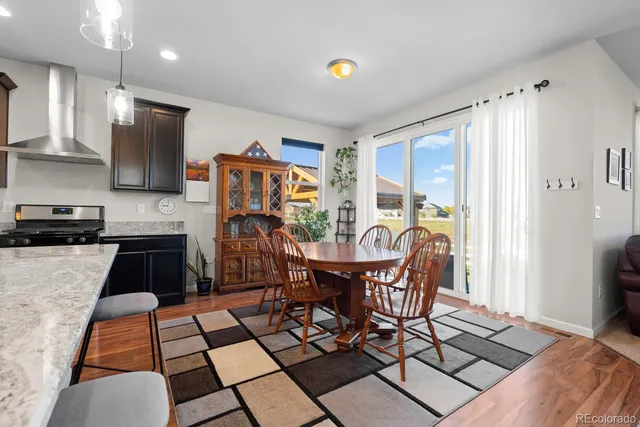 a bathroom with a tub sink shower and a mirror