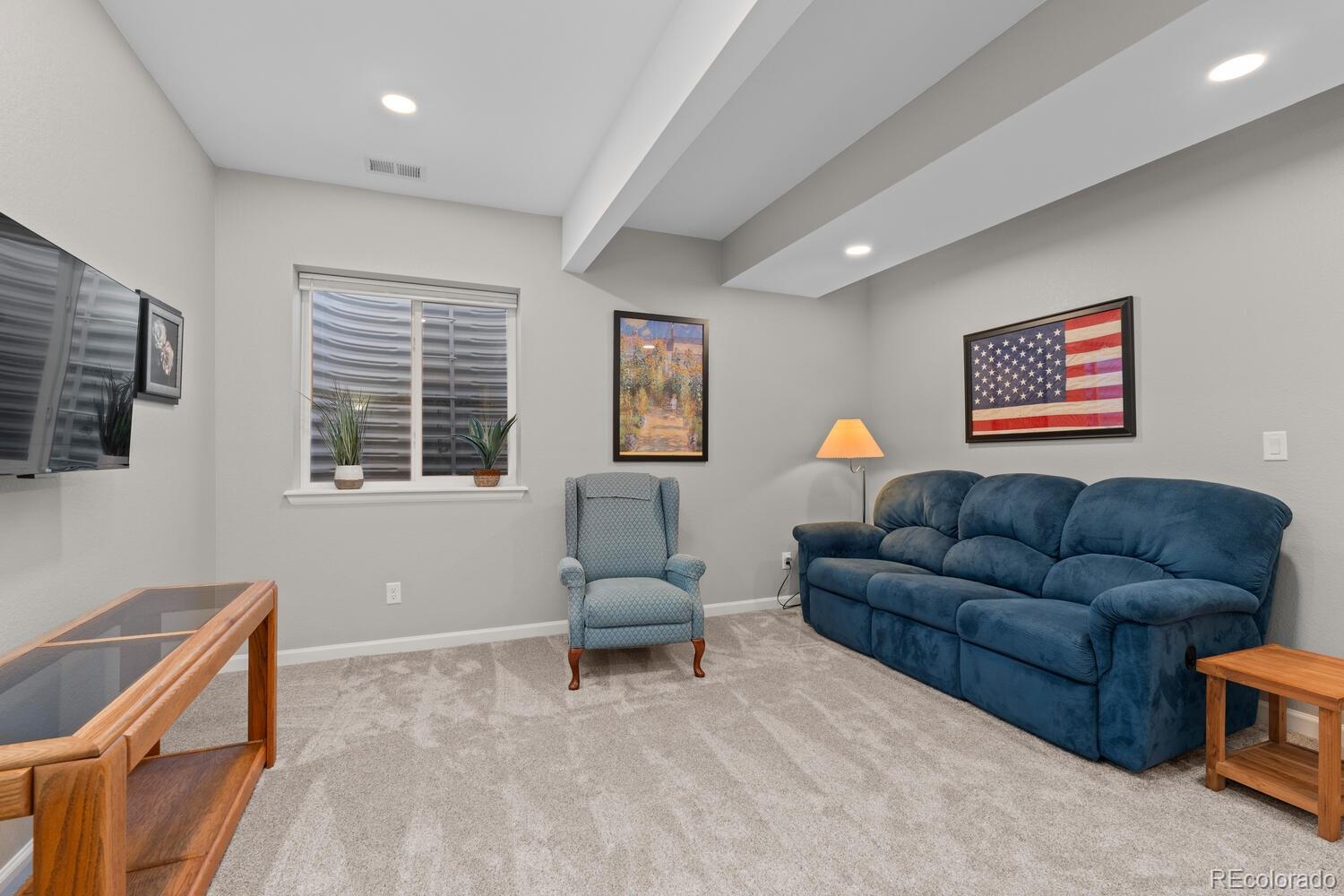 1587 Lake Point Way Severance, CO 80550 - Photo 28 of 40 a living room with furniture and a window