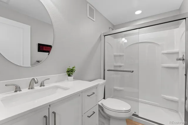 a view of backyard of house and car parked