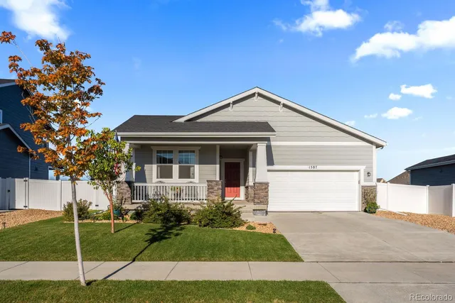 a view of a living room with a wooden floor