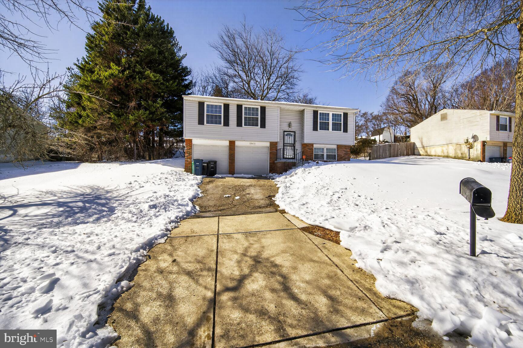 12611 Windbrook Drive Clinton, MD 20735 - Photo 1 of 32 a view of a house with snow on the road