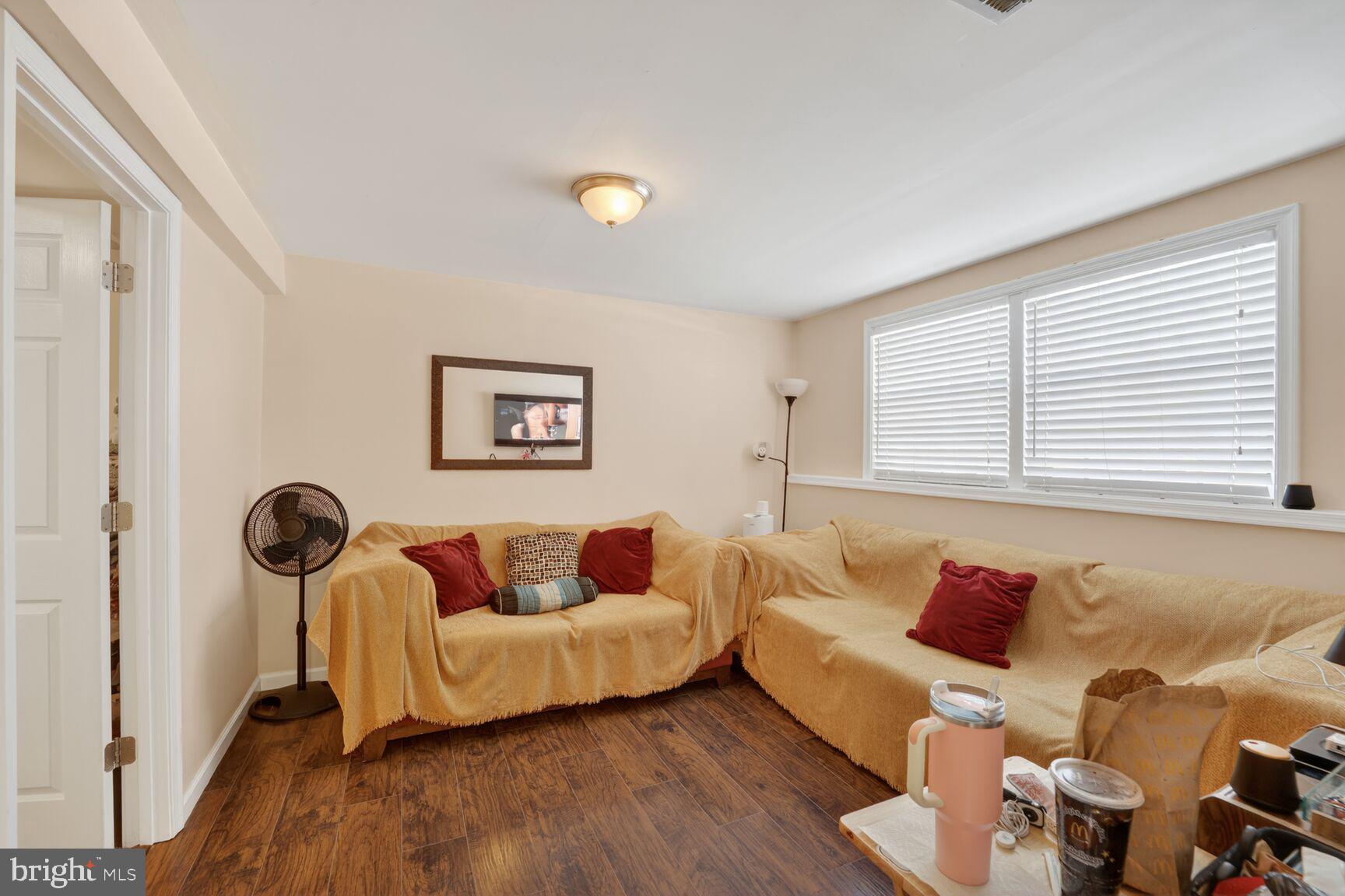 12611 Windbrook Drive Clinton, MD 20735 - Photo 22 of 32 a living room with furniture and a window