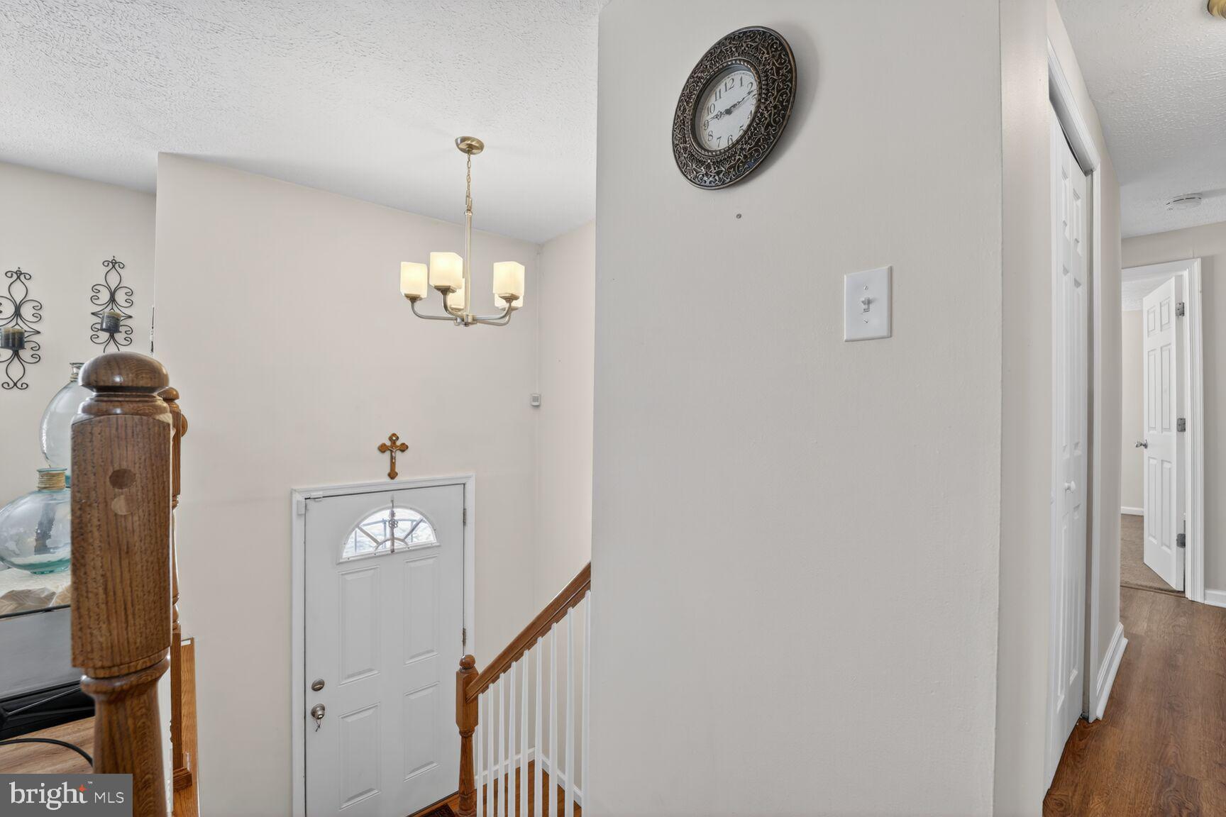 12611 Windbrook Drive Clinton, MD 20735 - Photo 28 of 32 a view of a hallway with wooden floor