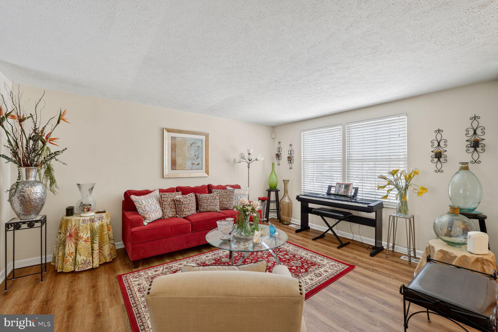 12611 Windbrook Drive Clinton, MD 20735 - Photo 4 of 32 a living room with furniture and a wooden floor