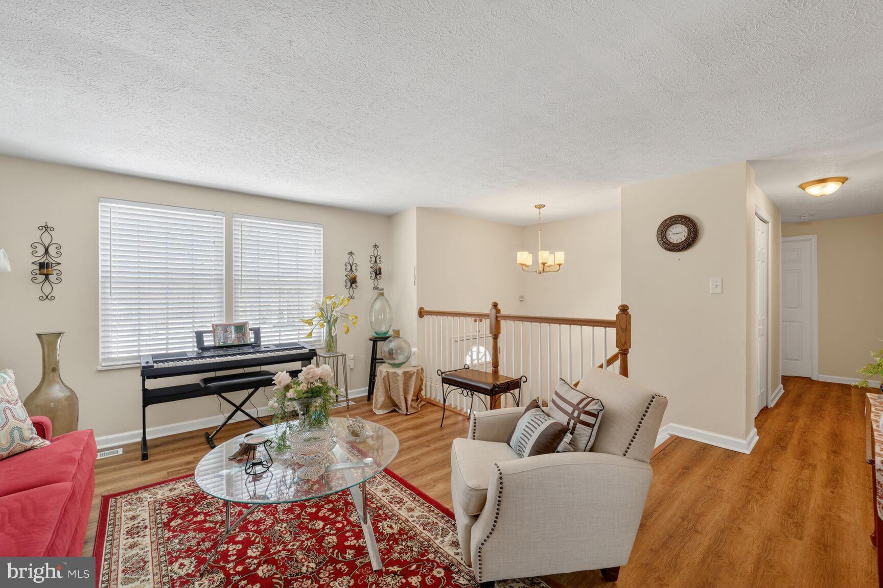 12611 Windbrook Drive Clinton, MD 20735 - Photo 5 of 32 a living room with furniture and a large window