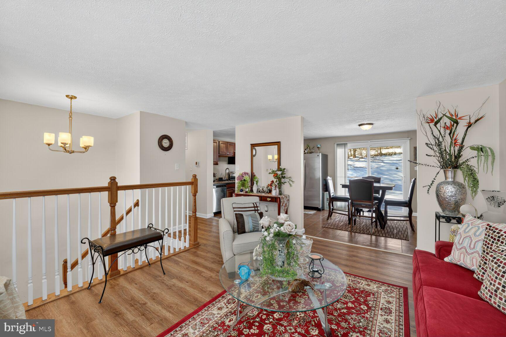 12611 Windbrook Drive Clinton, MD 20735 - Photo 6 of 32 a living room with furniture dining table and a window