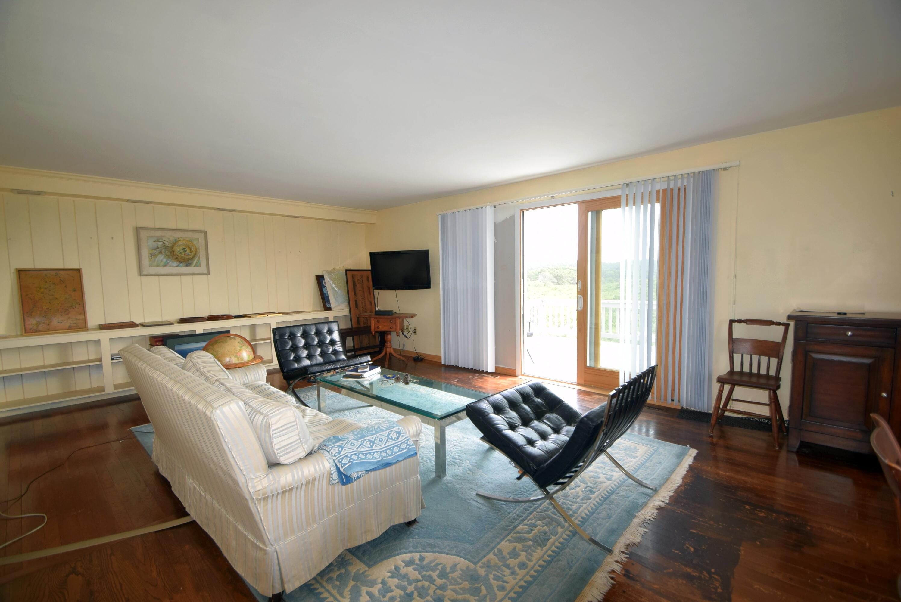 2 Ryder Hollow Road Truro, MA 02666 - Photo 13 of 31 a living room with furniture floor and a flat screen tv