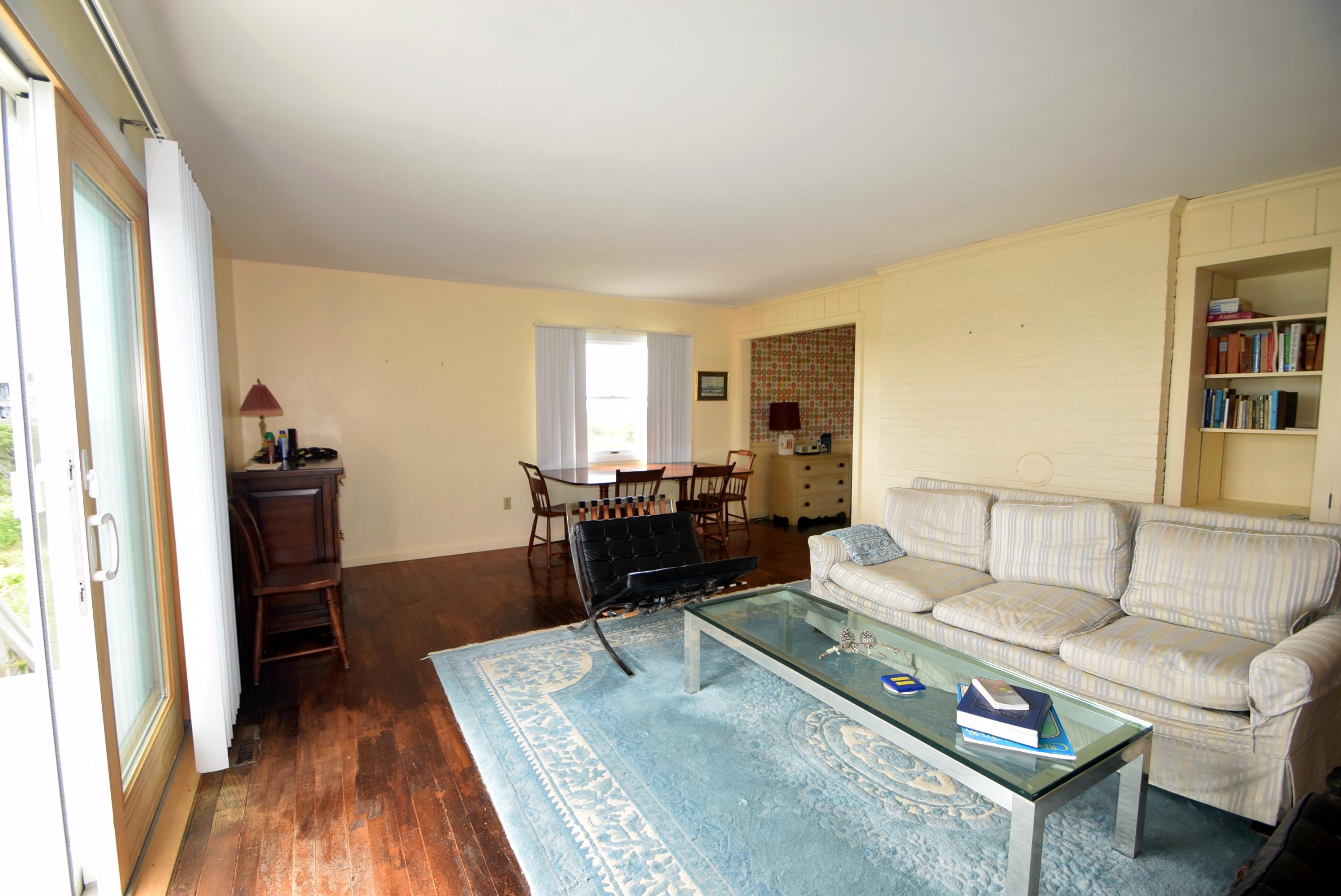 2 Ryder Hollow Road Truro, MA 02666 - Photo 15 of 31 a living room with furniture and a wooden floor