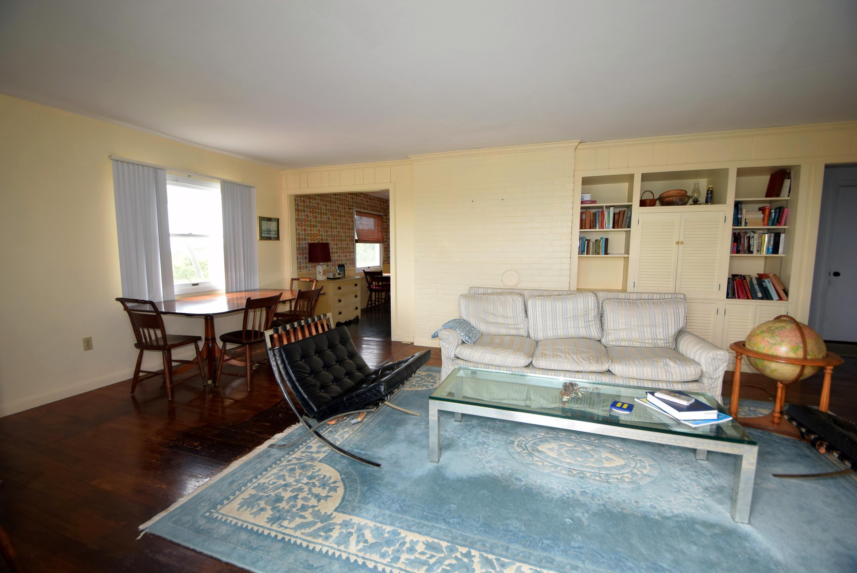 2 Ryder Hollow Road Truro, MA 02666 - Photo 16 of 31 a living room with furniture and wooden floor