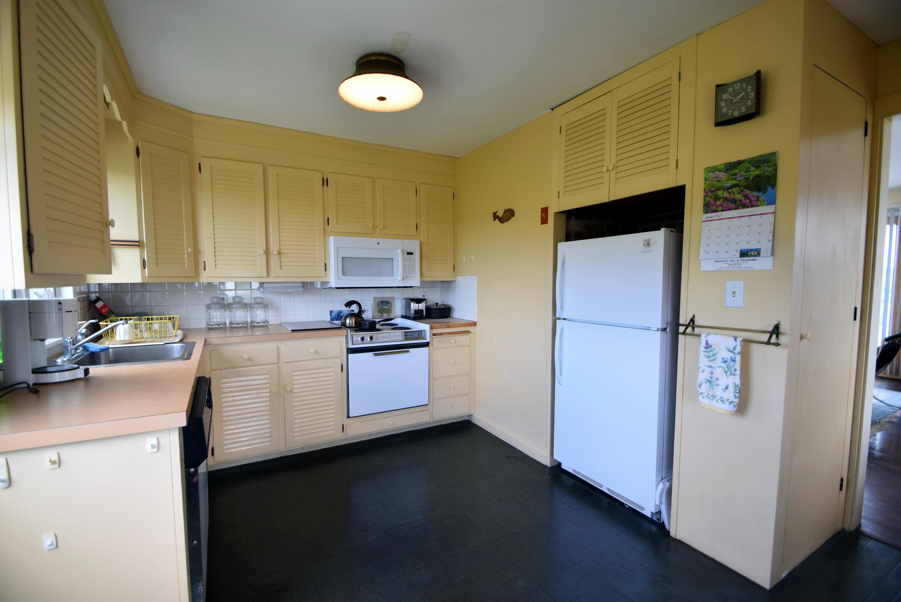 2 Ryder Hollow Road Truro, MA 02666 - Photo 18 of 31 a kitchen with a sink stainless steel appliances and cabinets