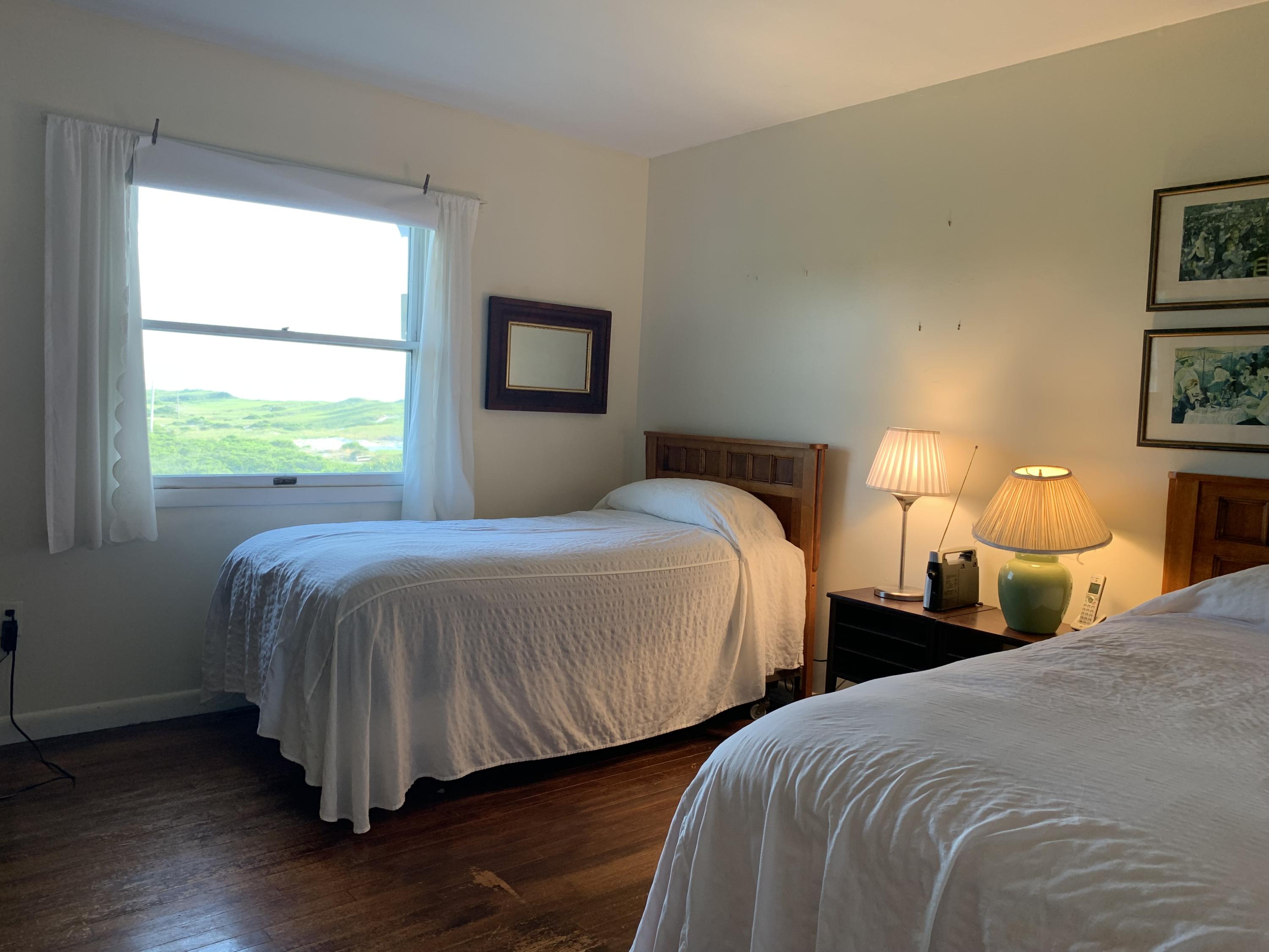 2 Ryder Hollow Road Truro, MA 02666 - Photo 20 of 31 a bedroom with two beds and a window
