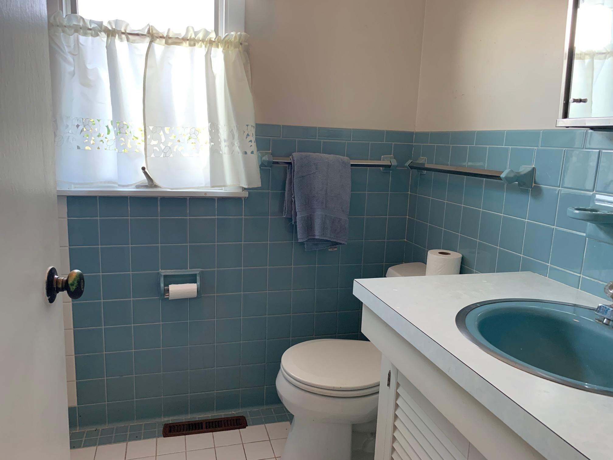 2 Ryder Hollow Road Truro, MA 02666 - Photo 21 of 31 a bathroom with a sink a toilet and window