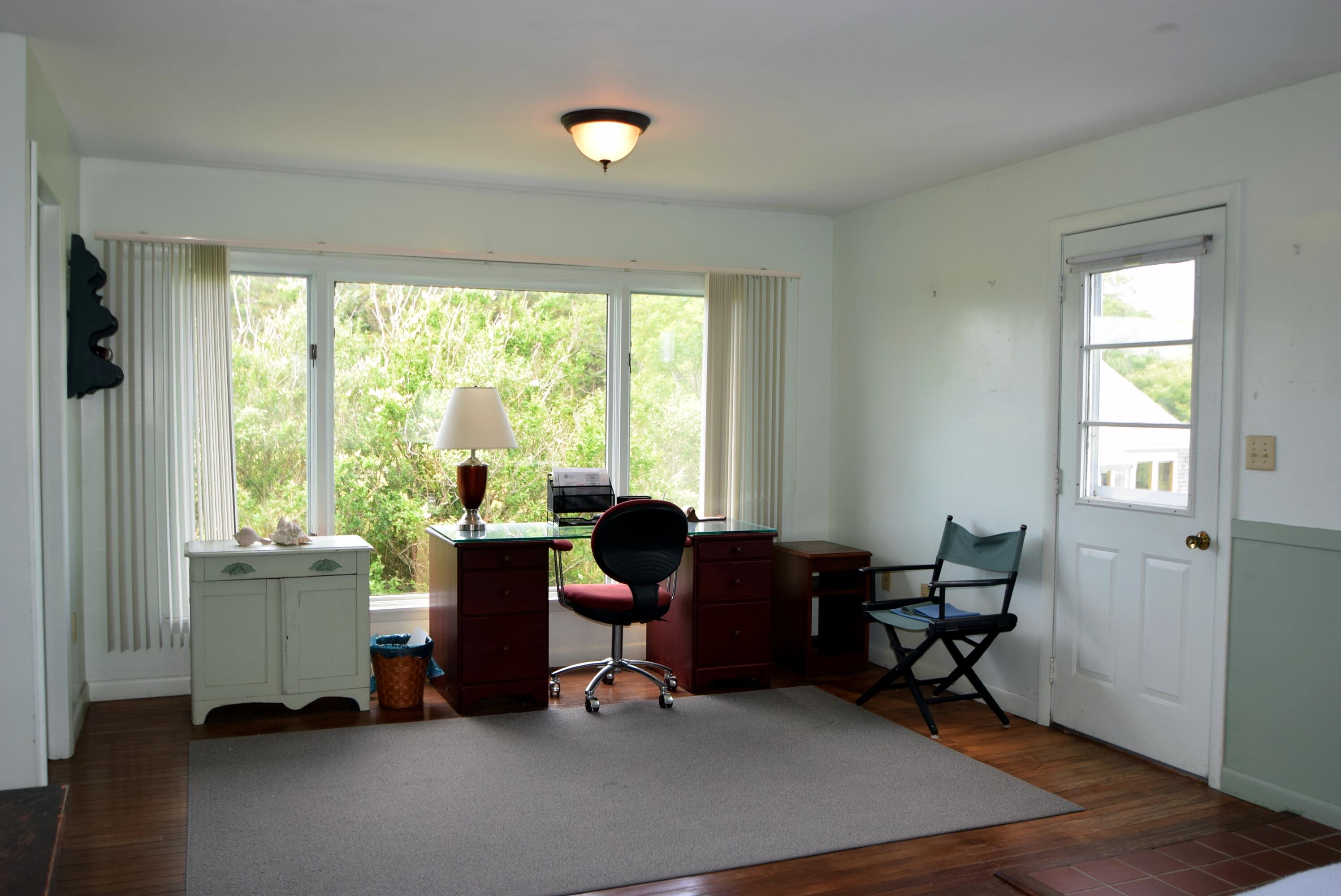 2 Ryder Hollow Road Truro, MA 02666 - Photo 22 of 31 a view of a workspace with furniture and a window