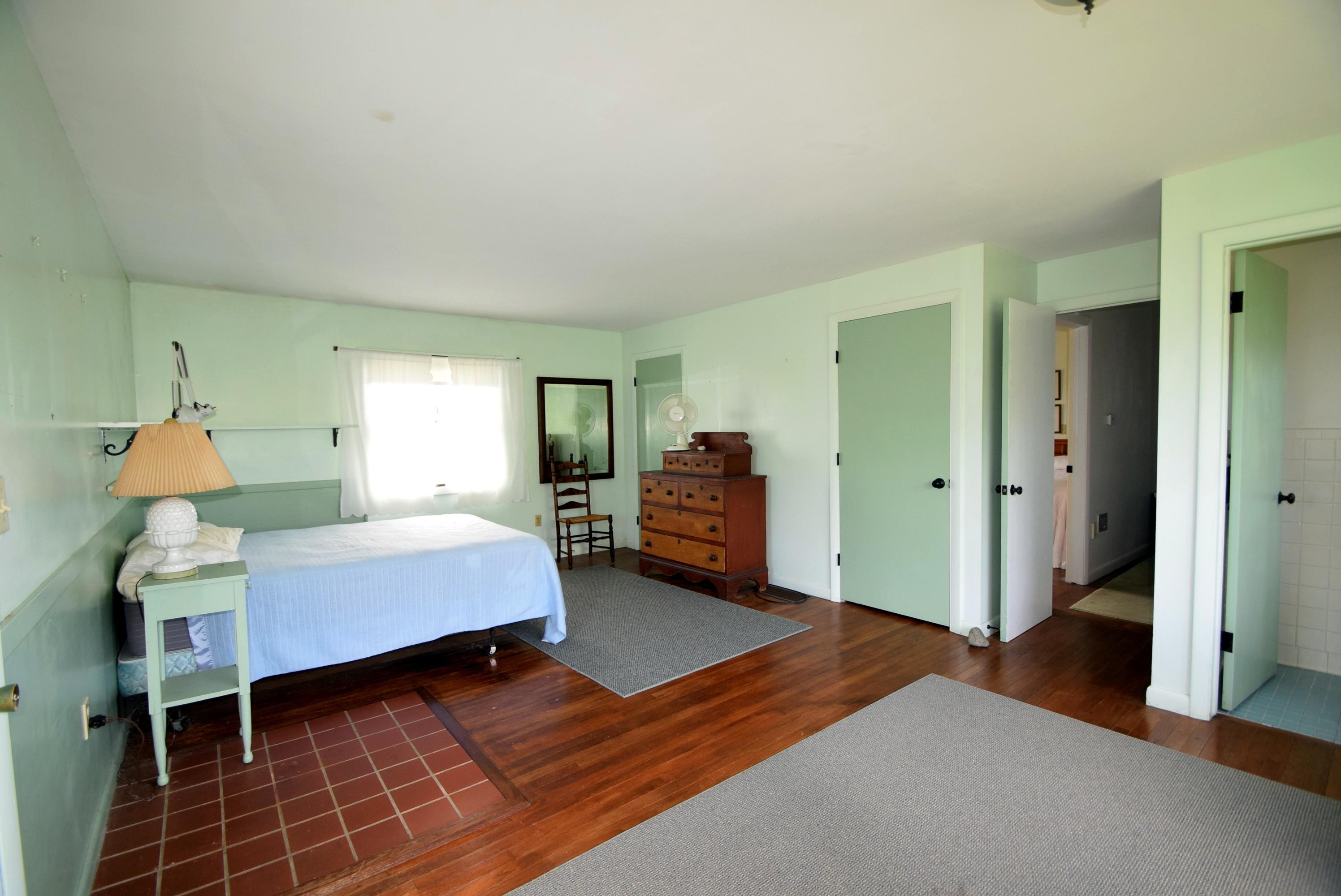2 Ryder Hollow Road Truro, MA 02666 - Photo 24 of 31 a bedroom with a bed and window