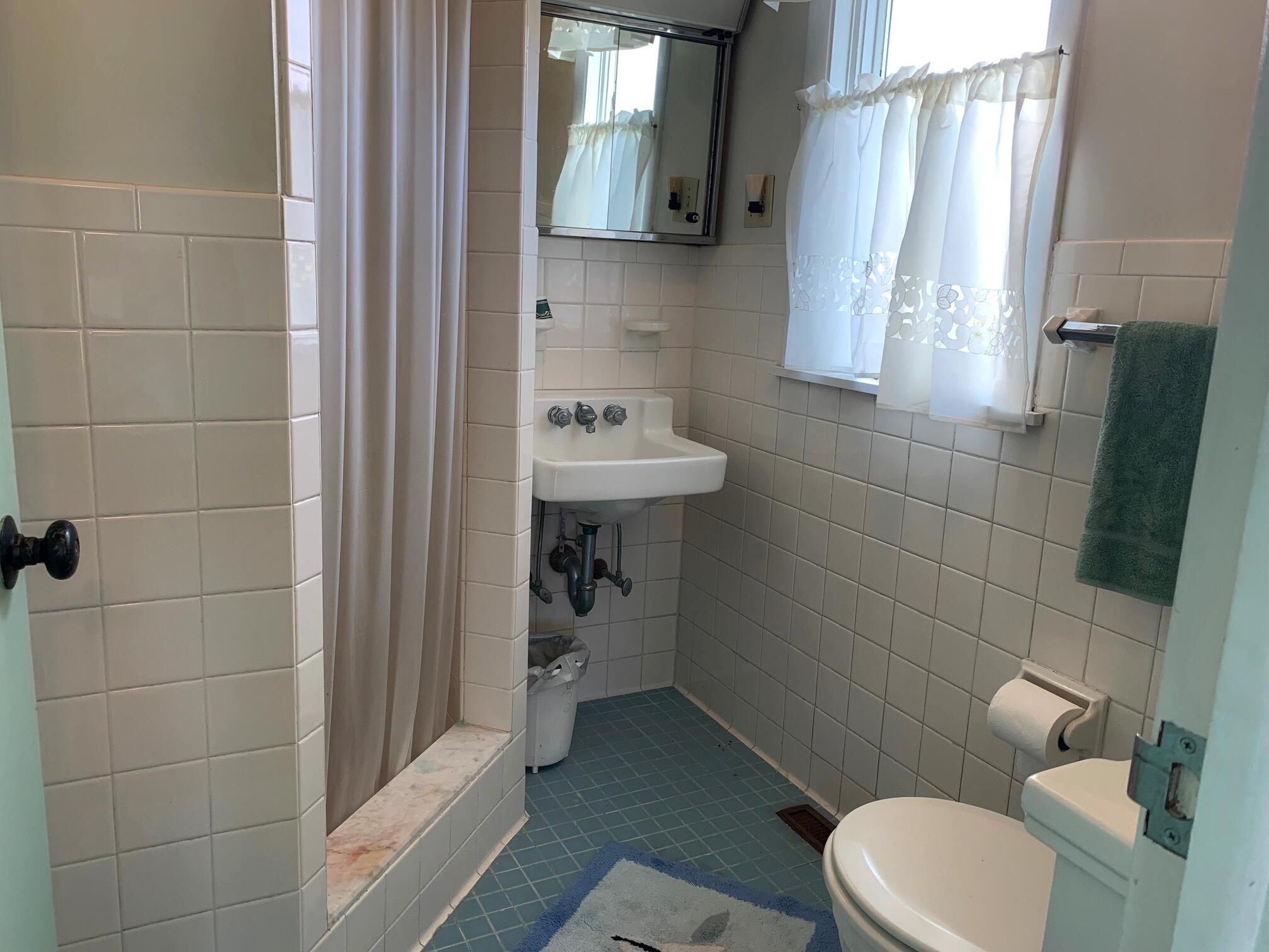 2 Ryder Hollow Road Truro, MA 02666 - Photo 26 of 31 a bathroom with a toilet sink and mirror