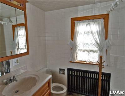 978 Bushkill Center Road Nazareth, PA 18064 - Photo 11 of 11 a bathroom with a sink and a window