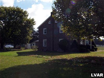 978 Bushkill Center Road Nazareth, PA 18064 - Photo 4 of 11 a view of a yard with plants and large trees