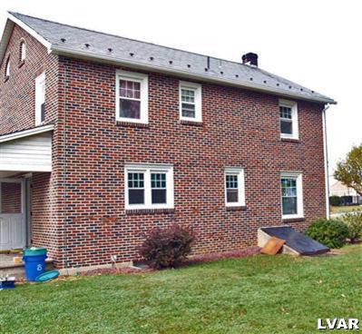 978 Bushkill Center Road Nazareth, PA 18064 - Photo 5 of 11 a front view of a house with a yard
