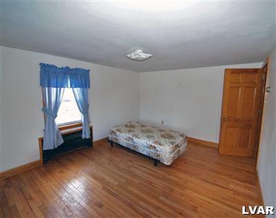 978 Bushkill Center Road Nazareth, PA 18064 - Photo 9 of 11 a living room with hard wood floors and a window