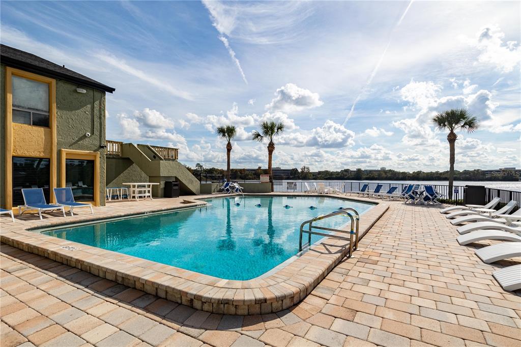 920 Lake Destiny Road, Unit F Altamonte Springs, FL 32714 - Photo 13 of 27 a view of a swimming pool with a lounge chair
