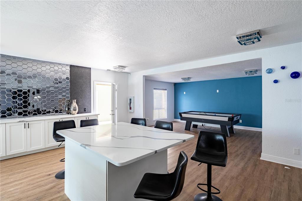 920 Lake Destiny Road, Unit F Altamonte Springs, FL 32714 - Photo 16 of 27 a kitchen with stainless steel appliances kitchen island a table and chairs in it