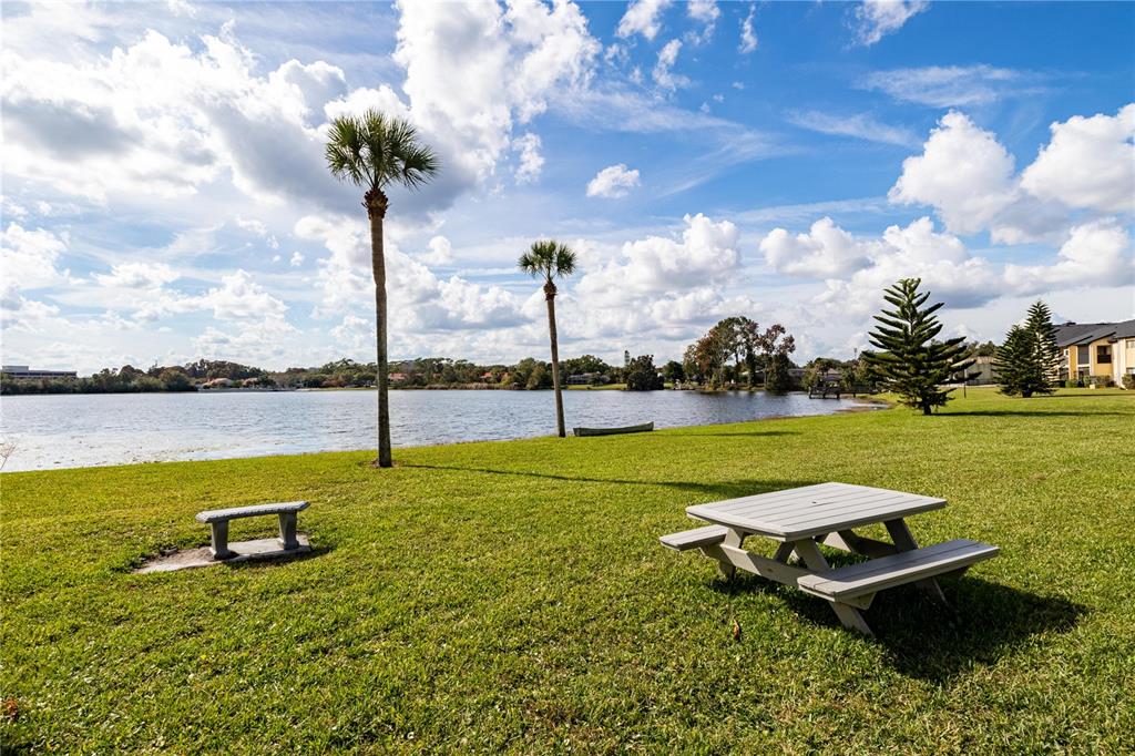 920 Lake Destiny Road, Unit F Altamonte Springs, FL 32714 - Photo 22 of 27 a swimming pool with some trees