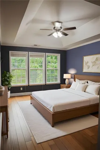 a bedroom with a large bed and a large window