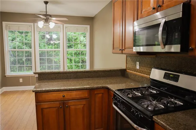 a kitchen with a stove and a microwave
