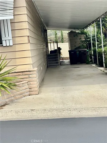 a front view of a house with a yard and outdoor seating