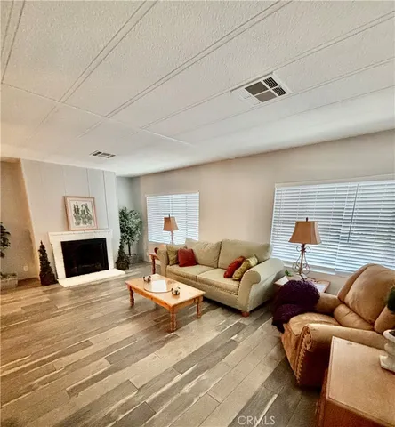 a bed room with a bed and a mirror