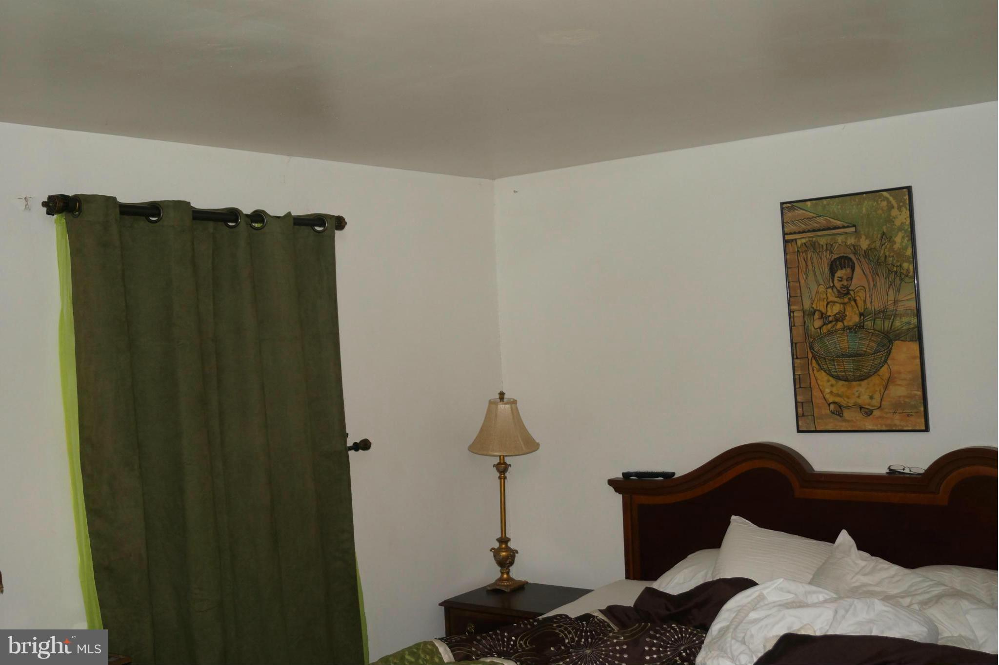 15003 Travert Way Silver Spring, MD 20906 - Photo 13 of 14 a bedroom with a bed and a closet
