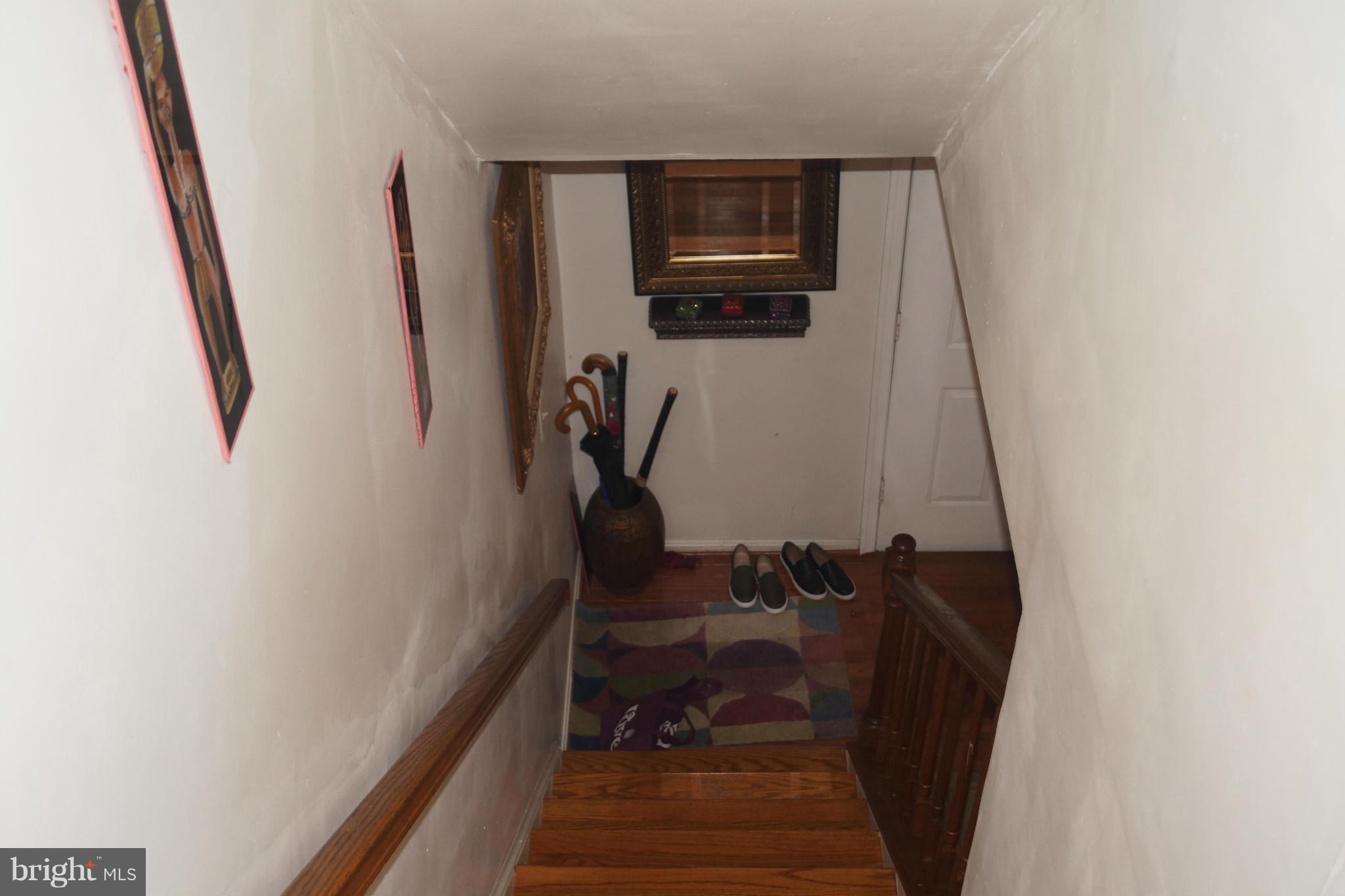 15003 Travert Way Silver Spring, MD 20906 - Photo 4 of 14 a view of a hallway with workspace and wooden floor