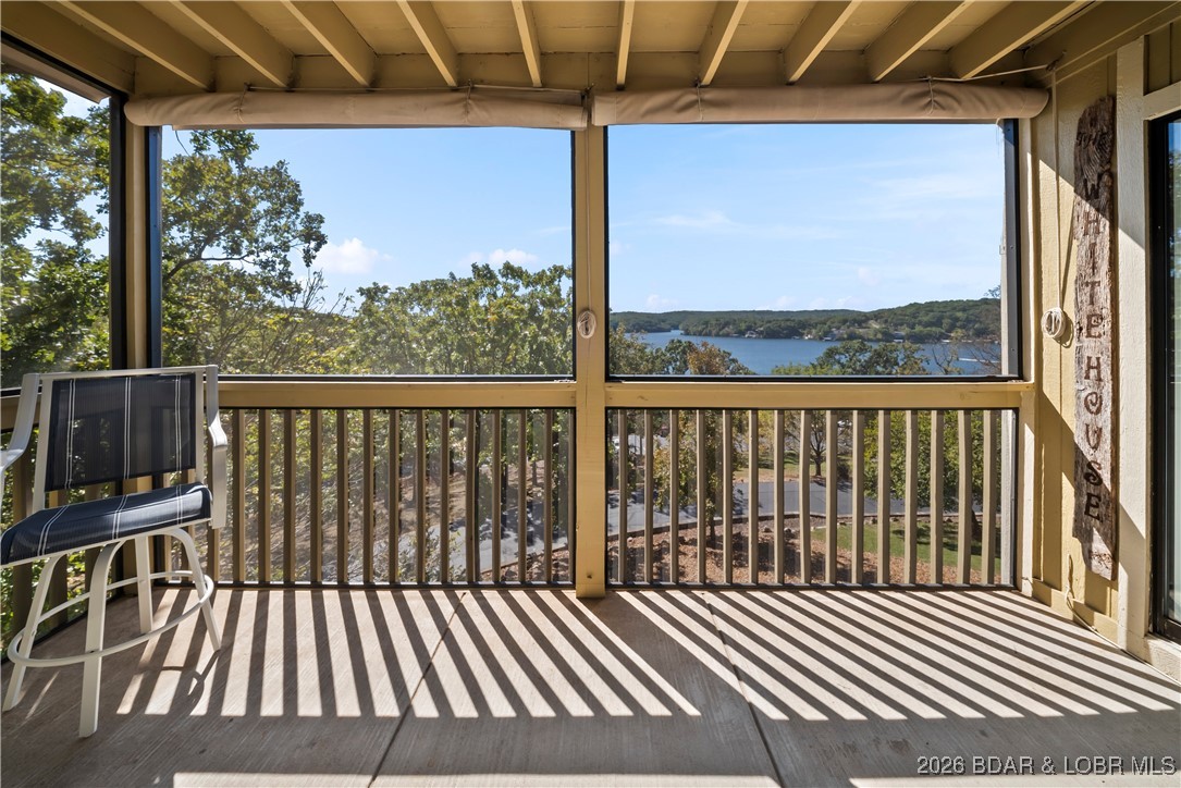 2500 Bay Point Lane, Unit 721 Osage Beach, MO 65065 - Photo 25 of 45 Screened in Porch off the Living Room