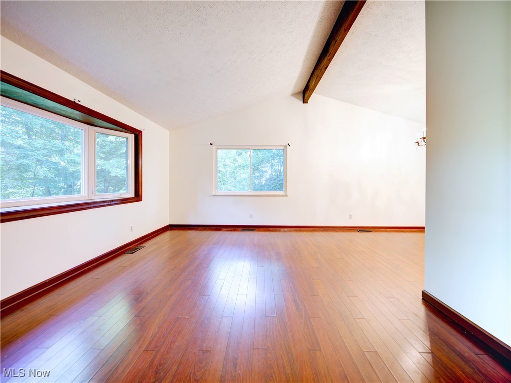 8075 Mulberry Road Chesterland, OH 44026 - Photo 33 of 38 Spare room featuring hardwood / wood-style flooring and a textured ceiling