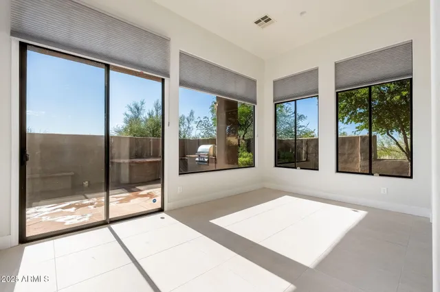 a open kitchen with granite countertop a sink and a refrigerator