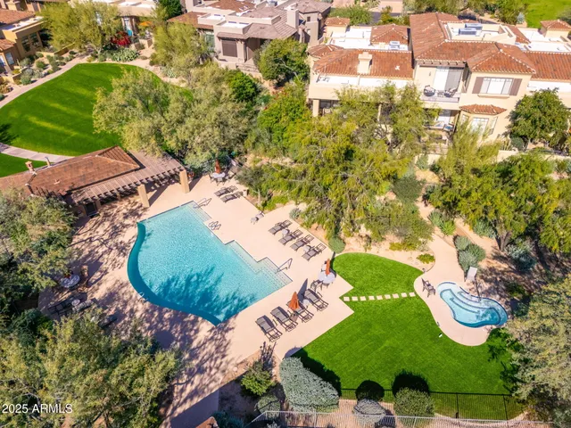 an aerial view of a house with a garden